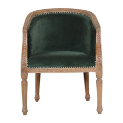 Chair with green velvet seat and wooden frame on a white background
