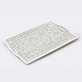 Rectangular cutting board with decorative patterns on a white background