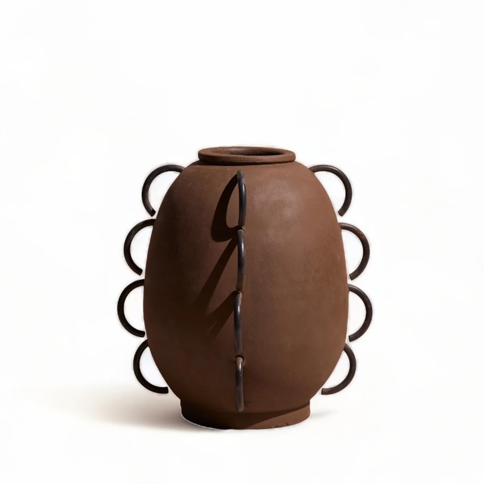 Brown ceramic vase with decorative black patterns on a white background