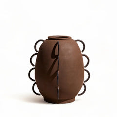 Brown ceramic vase with decorative black patterns on a white background