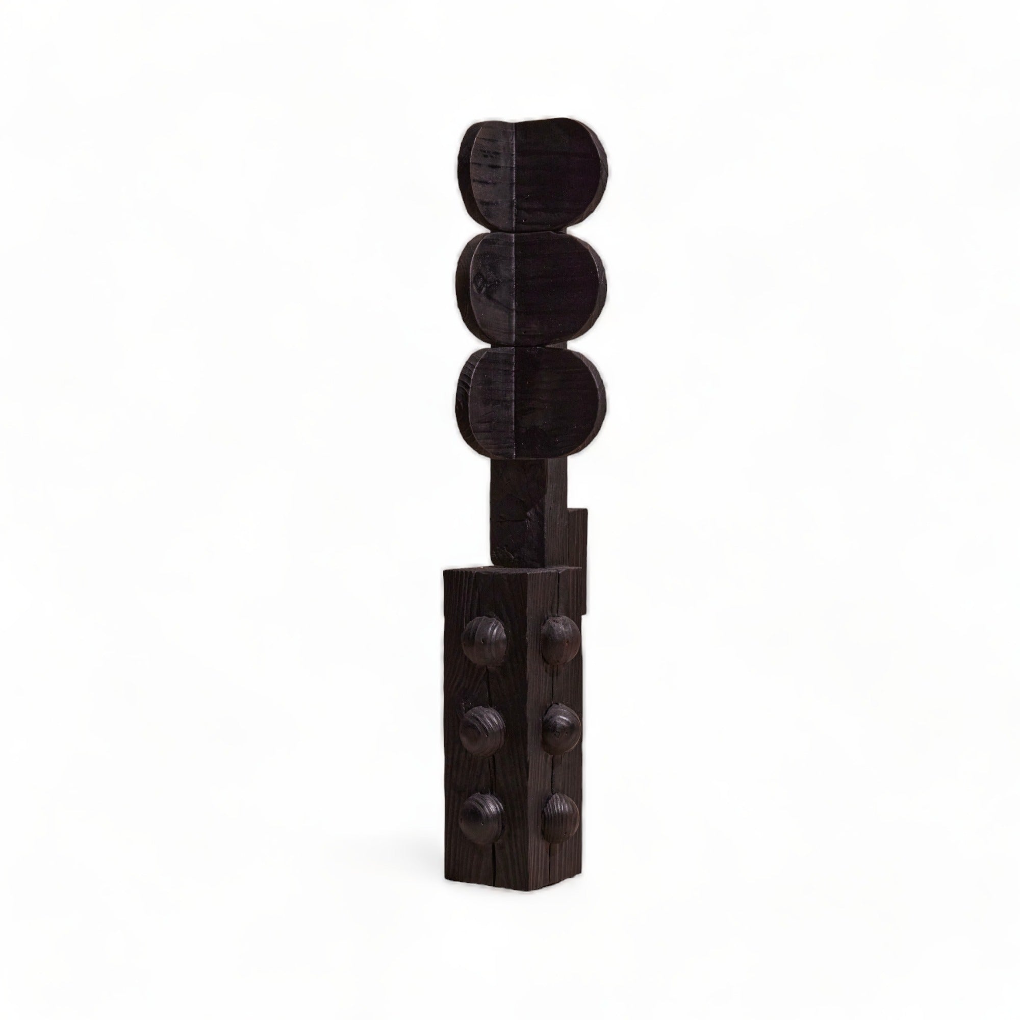 Black decorative item resembling a traffic light on a white background