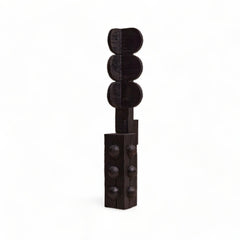 Black decorative item resembling a traffic light on a white background