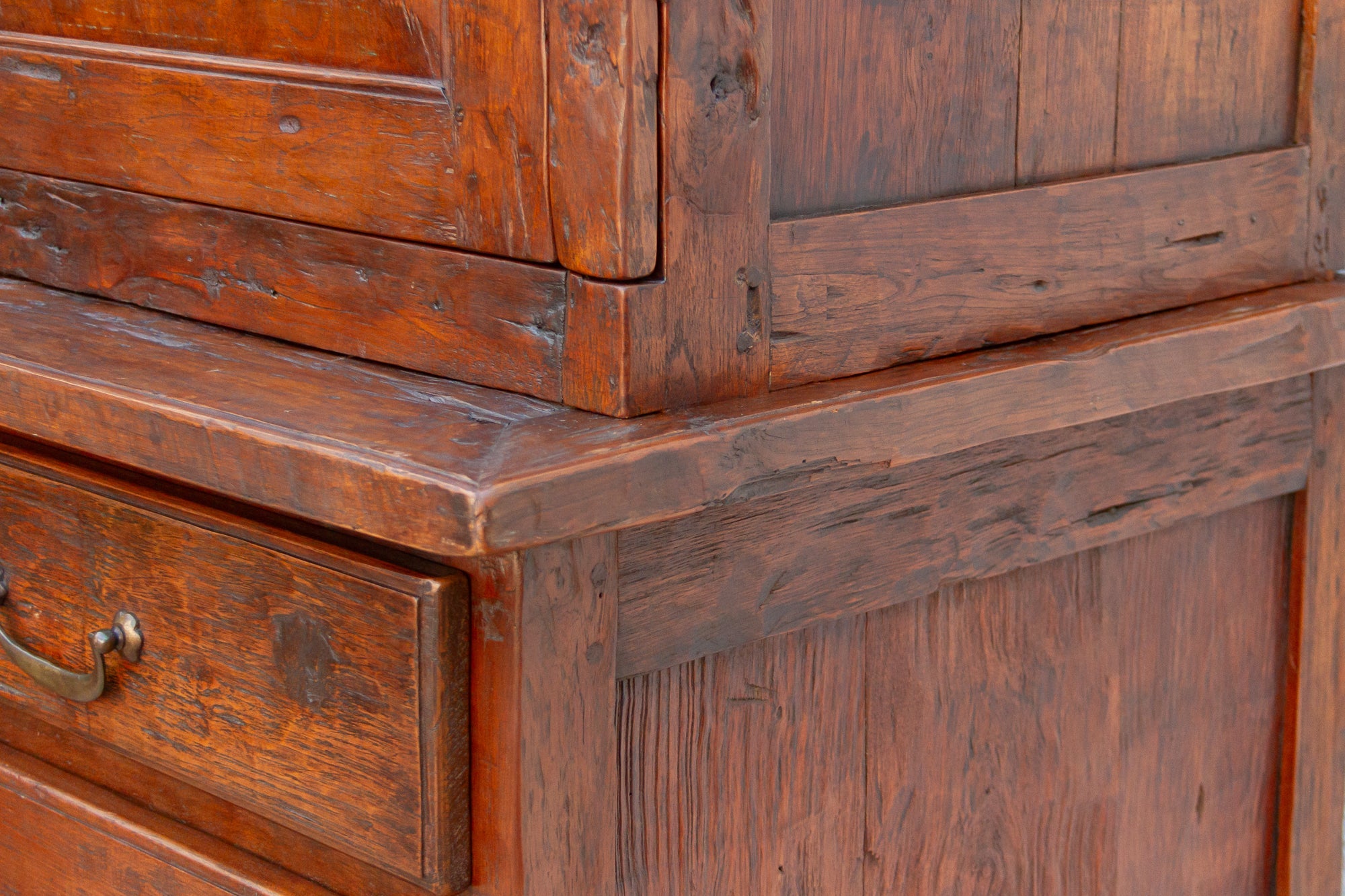 Close-up of a wooden cabinet with a drawer