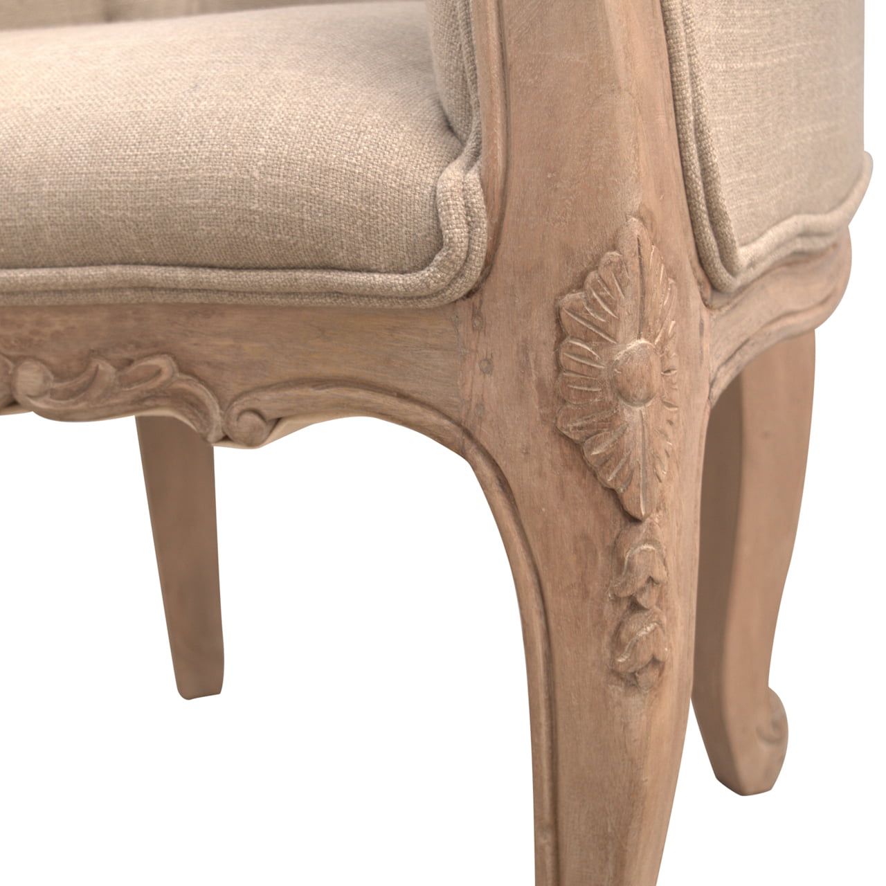 Close-up of a decorative chair with intricate carvings on a white background