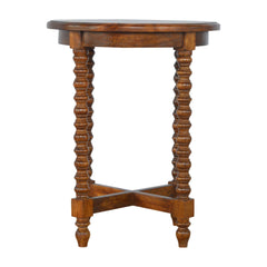 Wooden side table with turned legs on a white background