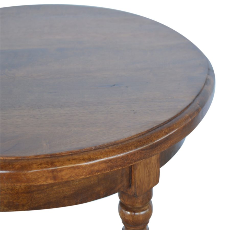 Round wooden table with a dark finish on a white background