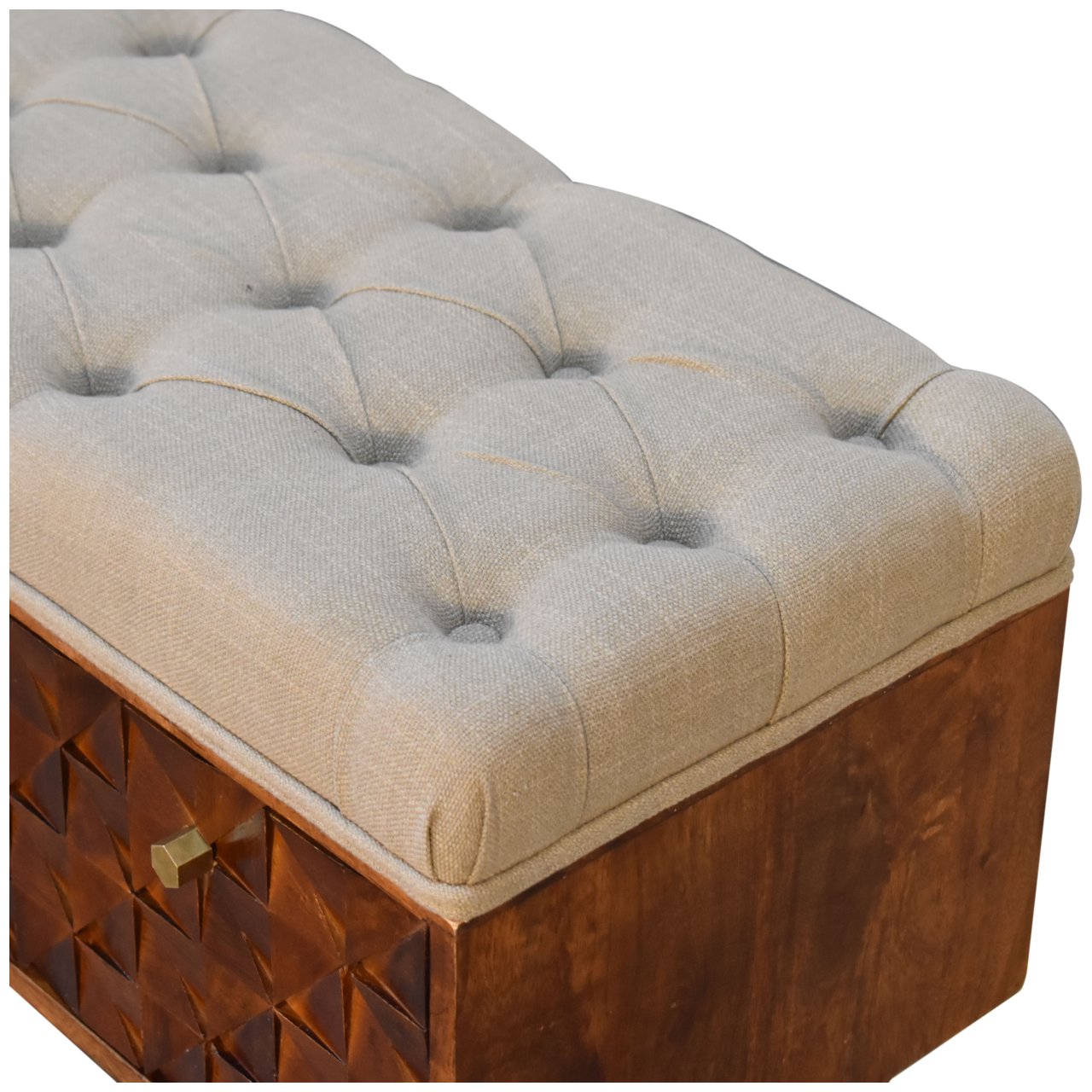 Beige tufted cushion on a wooden storage bench with geometric pattern.