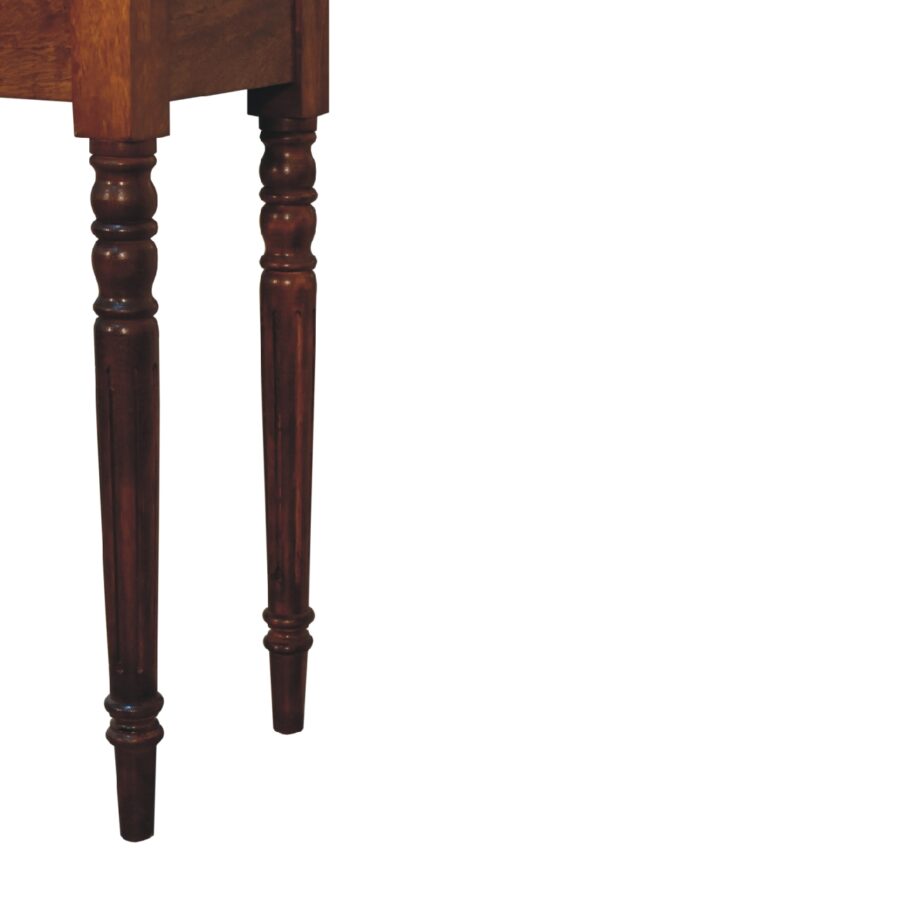 Close-up of a wooden table leg on a white background