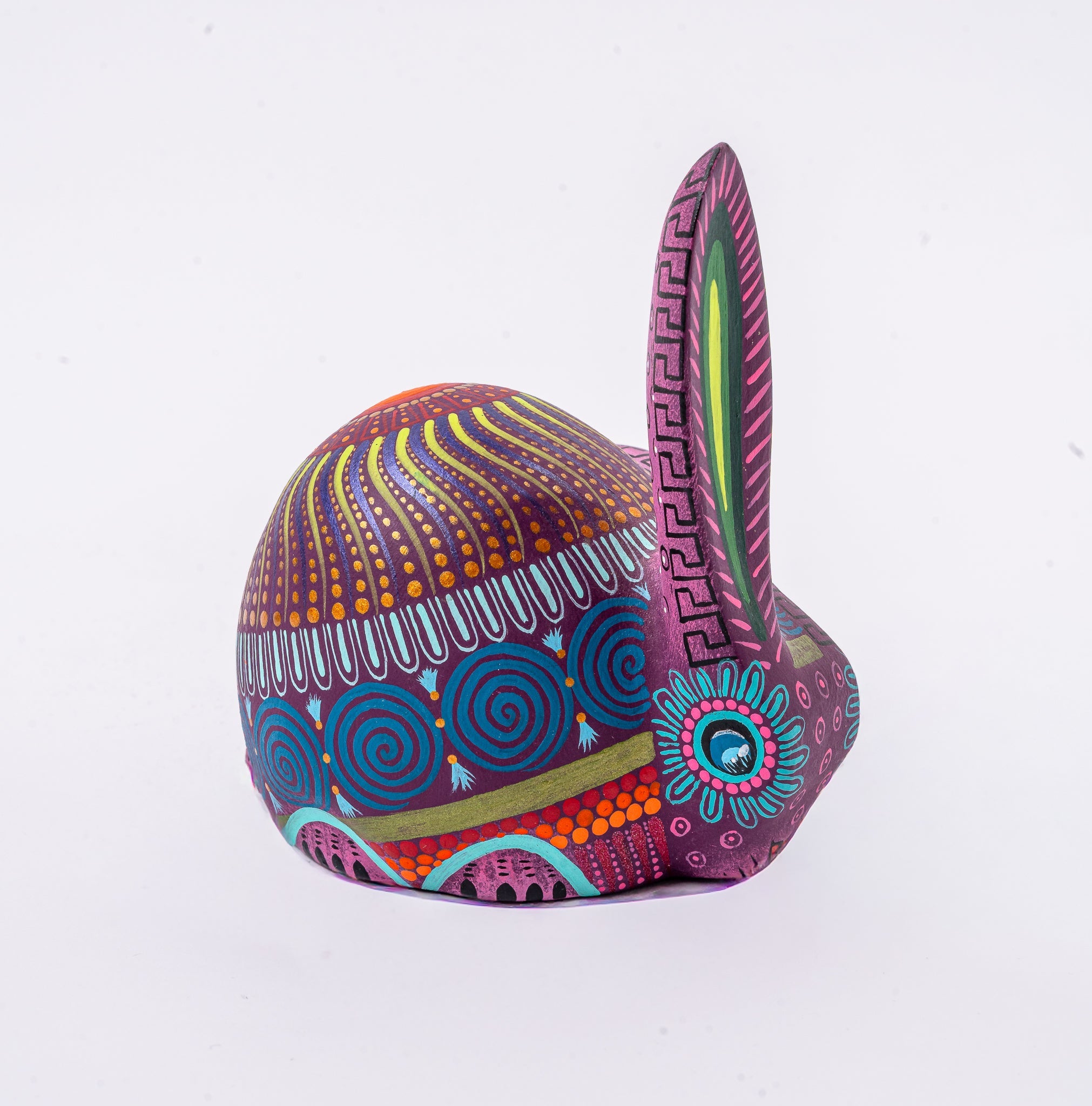 Colorful rabbit-shaped decorative item with intricate patterns on a white background