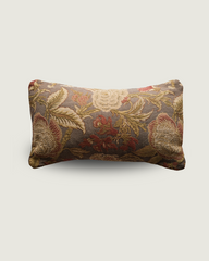 Decorative pillow with floral pattern on a light gray background