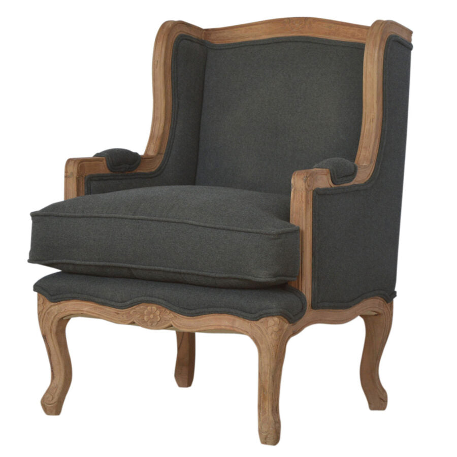 Chair with dark gray cushion and wooden frame on a white background