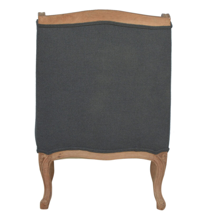 Chair with dark upholstered seat and wooden frame on a white background